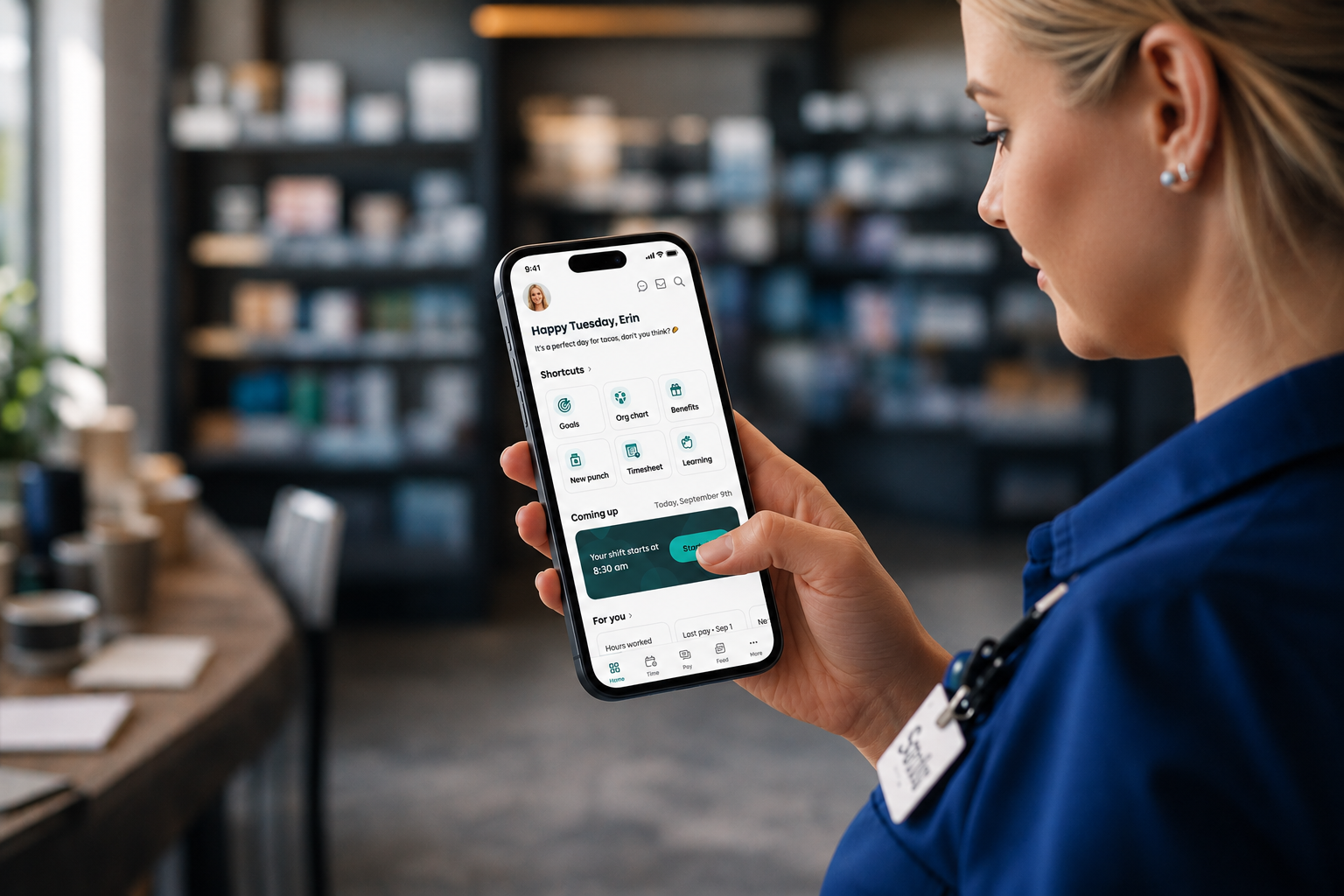 Employee using the UKG mobile app on a phone during a shift